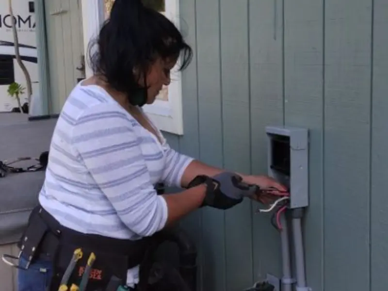 Licensed electrician wiring an exterior subpanel in Fort Stockton