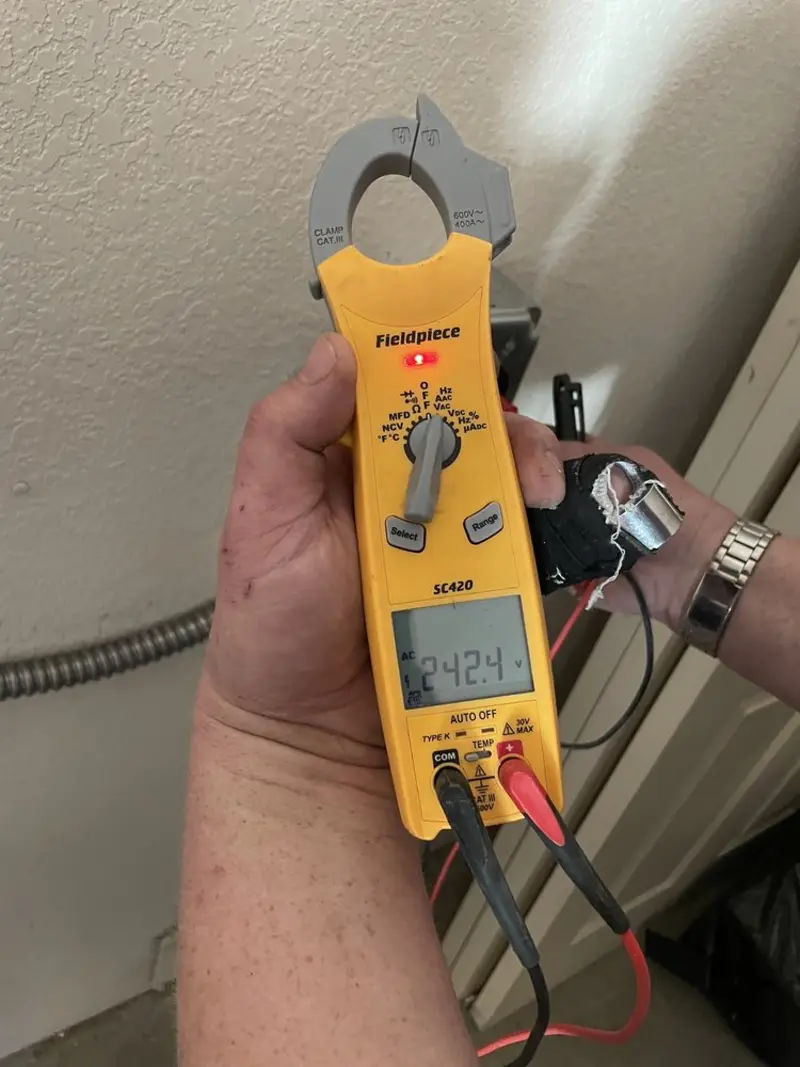 Voltage testing with clamp meter during Outlet Installation in Fort Stockton
